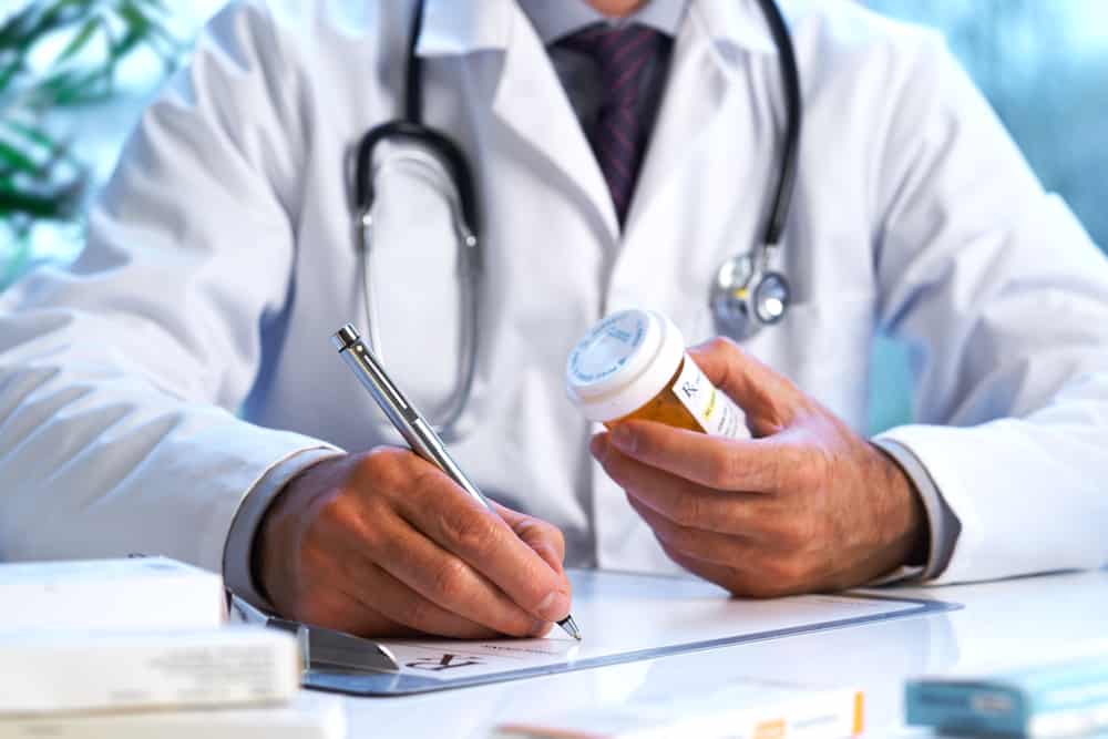a doctor writing a prescription