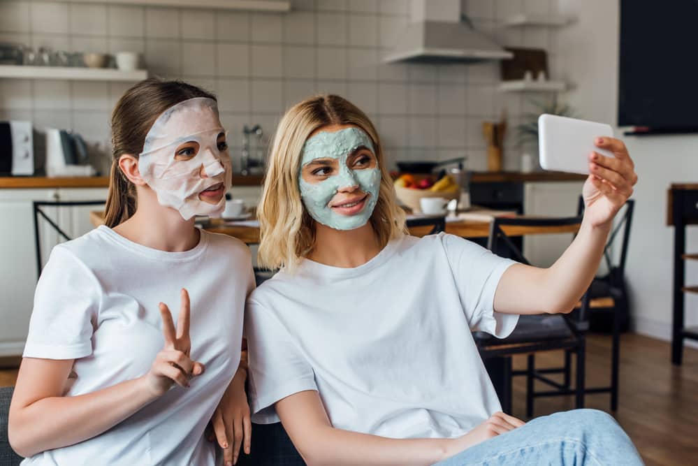 Two young women practicing self care